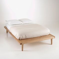 the bed is made up and ready for someone to use it in their home or office