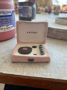 a small pink box sitting on top of a table