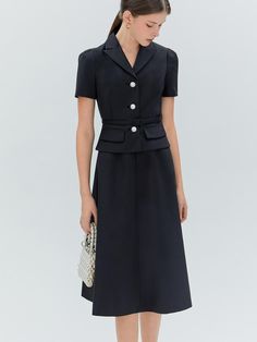 This product, the Erika Flare Dress, encapsulates a timeless elegance with a fitted bodice that flares into a graceful midi-length skirt. The addition of a matching belt enhances the dress's classic silhouette, drawing attention to the wearer's waist. It features a neatly tailored collar and a sleek button-down front, which add a touch of formality to the otherwise soft-flowing form. - This Erika Flare Dress includes a neatly tailored collar that frames the neckline beautifully.- The included belt cinches at the waist, providing a flattering shape and refined detail.- A button-down front offers a versatile closure that is both functional and stylish.- The dress's skirt flares gently from the waist, creating a silhouette that moves with grace and poise. Corporate Dresses Offices Classy, Elegant Midi Dress Classy, Midi Dress Classy, Work Photos, Model Clothes, Work Outfit Office, Silhouette Drawing, Corporate Dress, Dramatic Classic