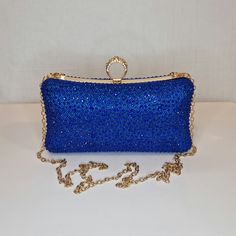 Womens royal blue sparkly evening clutch bag with all-over crystal rhinestone embellishment and crystal diamond detailed top closing clasp Can be used with or without long shoulder chain (included) size approx- H 10cm x W 20cm Free Royal Mail delivery is an estimated 3-5 days but this can occasionally be slightly longer which solely on the Royal Mail side. We do offer guaranteed next day delivery but please contact us prior to ordering as this would incur a small upgraded shipping charge. We als Gold Clutch Purse, Blue Clutch, Blue Cobalt, Gold Clutch, Royal Blue And Gold, Blue Handbags, Mail Delivery, Blue Purse, Crystal Diamond