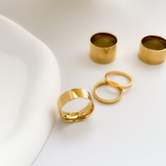 This perfect everyday ring is made of 18K gold on special titanium steel imported from Japan. Non-tarnish.It complements any outfit perfectly by itself or by stacking with any statement rings, or with any other width band rings.Works well as both a men's and women's wedding band, as well as a promise ring, total unisex design.To extend jewelry lifespan please have the ring stay away from chemicals like lotions and sanitizers.• S P E C I F I C A T I O N •Finish: 18K PVD gold on titanium steel#Hashtag18K Gold Band Ring, Gold Stacking Ring, Stackable Ring, Thick Ring, Thin Ring, Narrow Ring, Couple Ring, Couple Band, Gold Band for him, Gold Band for Couples, Gold Stacking Ring for him, Statement Rings, Different Size Band Rings, Tungsten Carbide Ring,Thin Band Ring, Minimalist Band Engagement Couple Band, Thick Ring, Gold Flats, Tungsten Carbide Rings, Couple Jewelry, Everyday Rings, Gold Ring Stack, Gold Band Ring, Demi Fine Jewelry