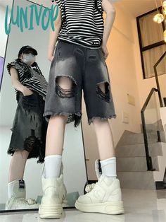 SPECIFICATIONS Decoration: HOLE Fabric Type: Denim Pant Style: Regular Pattern Type: Solid Fit Type: Regular Style: Casual Material: COTTON Waist Type: HIGH Gender: WOMEN Item Type: Shorts Closure Type: Button Fly Size S Waist 64 cm Hips 100 cm Length 52 cm M Waist 68 cm Hips 104 cm Length 52 cm L Waist 72 cm Hips 108 cm Length 53 cm XL Waist 76 cm Hips 112 cm Length 53 cm The above dimensions are measured manually in kind, and there will be a 1-3cm error due to different measurement methods. Th Black Wide Leg Jean Shorts For Summer, Black Wide Leg Jean Shorts For Spring, Punk Style Ripped Short Bottoms, Edgy Baggy Bottoms With Frayed Hem, Baggy Black Denim Jean Shorts, Spring Punk Washed Black Bottoms, Black Baggy Jean Shorts Casual, Baggy Black Ripped Bottoms, Baggy Ripped Black Bottoms