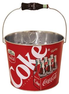 a coca - cola bucket with six bottles in it