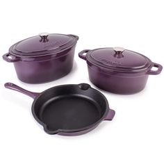 three purple pots and pans on a white surface with the lids down, one has a black cast iron skillet