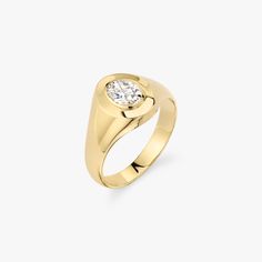 a yellow gold ring with a single diamond