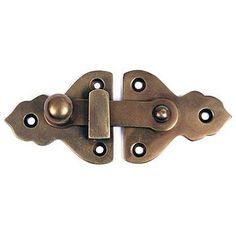 an antique brass plated door hinge with two holes