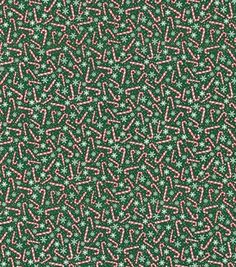 a green and pink pattern with stars on it