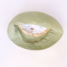 "A mint green linen wide brimmed sun hat that will protect your little beach bum from the sun. The wide brim covers the face, chest and shoulders for maximum sun protection. So let the sun shine! This summer hat will soon become a favorite on your adventures outside. Made from a medium weight mint green linen fabric. Inside liner made of white cotton. This hat has a chin strap with metal snap to help keep the hat on. Brim measures 3.5 inches. HAT SIZES AVAILABLE: 0-3 mos. - 12\" to 14\" head cir Green Linen Fabric, Baby Summer Hat, Hat For Baby, Floppy Beach Hat, Baby Sun Hat, Wide Brim Sun Hat, Sun Shine, Green Hat, Green Hats