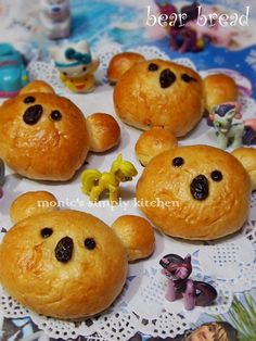 small teddy bears made out of bread on a doily