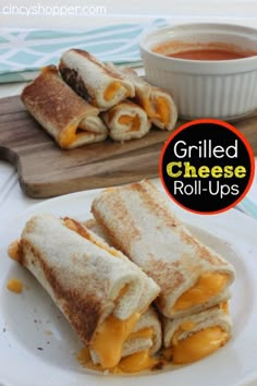 grilled cheese roll ups on a plate with dipping sauce