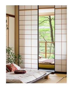 an open door leading to a bed in a room