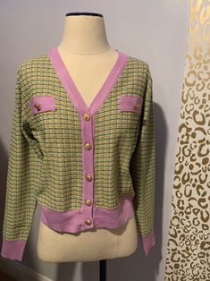 Green and purple knit cardigan with gold buttons Measurements: Bust: 41 in Shoulders: 18.5 in Sleeves: 24.5 in Length: 21 in Get A Clue, Purple Knit, Tartan Skirt, Womens Jackets, Gold Buttons, Clue, Green And Purple, Knit Cardigan, Tartan