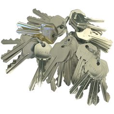 several keys are stacked on top of each other in the shape of a keychain