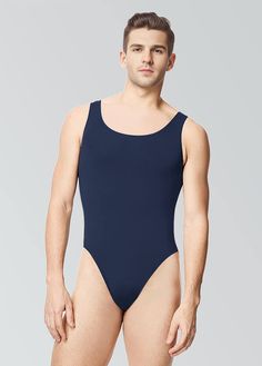 a man in a blue bodysuit is posing for the camera with his hands on his hips