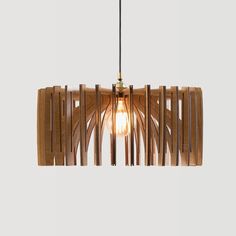 a wooden light fixture hanging from a ceiling