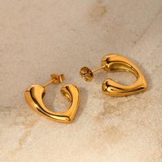 ✦ Experience the perfect blend of romance and elegance with our 18K Gold Plated Heart C Hoop Earrings. Each earring is beautifully designed with a hollow heart shape, adding a subtle yet charming touch of love to your style. The C hoop design is both trendy and timeless, making these earrings a versatile addition to any jewelry collection. Crafted with precision and coated in 18K gold, these earrings boast a brilliant shine and a lasting finish. Ideal for both everyday wear and special occasions Basic Jewelry, Hollow Heart, Hoop Design, Crystal Hoop Earrings, Nose Rings Hoop, The C, Fashion Jewelry Earrings, Stylish Jewelry, Gemstone Bracelets