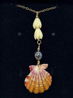 This beautiful yellow Hawaiian sunrise shell is accompanied by a gorgeous peacock mother of pearl and some pikake beads! This amazing combination is showcased on a dainty 18 inch 14k gold filled chain.  Check out all the other amazing shell jewelry in my shop! https://scubastevedesigns.etsy.com I dive Hawaiian waters searching for the most beautiful shells to turn into jewelry that is unique to the Hawaiian islands. My shells are found from 60 - 120 ft deep. I personally collect, clean, and wire wrap my shells. Each necklace is durable yet dainty.  (Q9) 18 inch 14k gold filled Shell Jewelry, Hawaiian Islands, Shell Pendant, Shell Necklaces, Mother Of Pearl, Pearl Necklace, Shells, Jewelry Necklace Pendant, Jewelry Necklaces