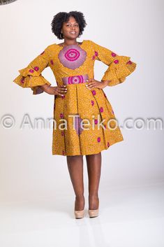 A gorgeous, vivid gold tone authentic African print midi dress, fit at the bodice and flares from the waist to right below the knee. with pleats, has 2 inside pockets. fully linned. Yellow Pleated A-line Midi Dress, Fitted Yellow Pleated Midi Dress, Gold Fitted A-line Midi Dress, Gold Knee-length Midi Dress, Fulani Earrings, Dress Gold, Print Midi Dress, Printed Midi Dress, Gold Dress