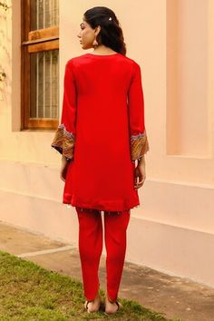 Red flared kurta featuring bead, zardozi, cutdana and resham embroidered yellow yoke and sleeve hem. Paired with a tulip pant. - Aza Fashions Fitted Red Kurta With Dabka Detailing, Elegant Red Kurta With Embroidered Border, Red Embellished Unstitched Salwar Kameez, Festive Red Kurta With Cutdana Detail, Red Embellished Silk Kurta, Red Semi-stitched Shantoon Kurta, Red Embroidered Border Kurta, Red Embroidered V-neck Kurta, Ombre Dupatta