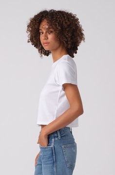 Because you need the perfect boxy, cropped tee to pair with high-waisted jeans. Featuring our signature double needle side seam detail, tonal topstitching, and subtle distressing around edges for a worn-in feel. COLOR: WHITE FIT & MEASUREMENTS: Length = 19 1/2" Cropped, shrunken fit Measurements taken from size Small Talhia is wearing size Small and is 5'10" Fits true to size Fabric & Care: 100% Cotton Machine wash cold, tumble dry low heat Made with love in Los Angeles Cropped Boxy Fit T-shirt, Cotton Relaxed Fit Cutoff Tops, Relaxed Fit Cotton Cutoff Tops, Cotton Cutoff Tops For Everyday, Fitted Cotton Cutoff Top, Boxy Fit Cropped T-shirt For Everyday, Everyday Boxy Fit Cropped T-shirt, Casual Everyday Cutoff Tops, White Cutoff Tops With Frayed Hem