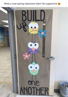 a door decorated with an image of birds and the words build up one another