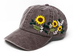 This hand embroidered flower baseball cap is a one-of-a-kind accessory that combines style and comfort. The cap is crafted from high-quality material, ensuring durability and comfort. The intricate floral design is hand-embroidered, giving each cap a unique touch and making it a standout piece. Whether you're running errands or enjoying a day outdoors, this cap will keep the sun out of your eyes in style. Flower is 100% hand embroidered on a 100% cotton wash baseball cap. Hat is one size fits al Spring Outdoor Baseball Cap With Embroidered Logo, Outdoor Baseball Cap With Embroidered Logo For Spring, Adjustable Brimmed Dad Hat For Spring, Spring Outdoor Hat With Embroidered Logo, Adjustable Brimmed Baseball Cap For Spring, Summer Snapback Hats With Custom Embroidery, Custom Embroidery Summer Baseball Cap, Custom Embroidered Summer Baseball Cap, Custom Embroidered Baseball Cap For Summer