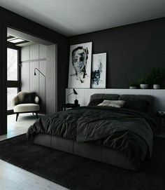 a black and white bedroom with a large bed