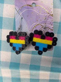 Unique and fun earrings! Have a creative and colorful style? These quirky earrings are perfect for you! if there is a specific pride flag that you would like to have, feel free to request it! If you're a fan of these, please check out our other accessories! We have a selection of shirts, necka, and other accessories to help creat your perfect outfit! Ships out within 1 week Kei Jewelry, Pixel Heart, Kawaii Earrings, Quirky Earrings, Pansexual Pride, Pride Flag, Colorful Style, Fun Earrings, Pride Flags