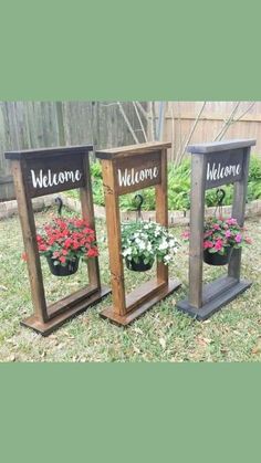 three wooden frames with flowers in them and the words welcome are displayed on each side