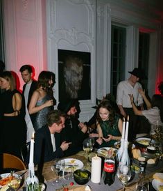 a group of people sitting around a dinner table