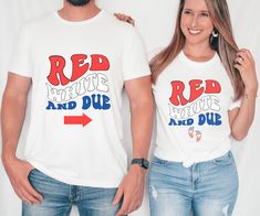 "Looking for a funny patriotic shirt to wear on 4th of July to let everyone know that you are expecting a little firecracker? Look no further than our Fourth of July couple shirts! These funny Red White and Due with red white and blue with American stars and stripes baby feet shirts are perfect for celebrating America's independence with your loved ones. Whether you're pairing them up or just wearing one as a fun novelty, these shirts make the perfect accessory and great idea for baby shower gift. * HOW TO ORDER *  ✺ Please note this is not a set and each shirt will need to be ordered individually and listing is for top only ✺ Please, check and review all photos.  ✺ Choose your style, size and color. Size chart is in pictures.  ✺ Click add to cart. You can go back to add more product ✺ At Patriotic Red Top With American Flag, Fun Blue Tops For 4th Of July, Funny Short Sleeve Tops For 4th Of July, Patriotic Red Shirt For 4th Of July, Red Patriotic Shirt For Memorial Day, Fun American Flag Print Top For 4th Of July, Patriotic Red Top For 4th Of July, Funny Cotton Tops For 4th Of July, Funny Red Pre-shrunk Tops