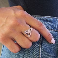 "This is a women's ring made of 925 sterling silver. It is a triangle ring with some geometrical shapes inside that makes it unique. It is shinny and high polish. Be creative and complete your outfit with this stunning minimal ring. It is eye-caching! Triangles represent strength, and can also represent concepts as past, present and future or spirit, mind and body. It comes in a cute box so it is gift-ready ! Urban jewelry, for those who not only want to wear special designs but also with meanin Silver Geometric Rings As Gifts, Geometric Silver Ring As Gift, Silver Geometric Ring As Gift, Silver Geometric Ring Gift, Silver Geometric Ring For Gift, Sterling Silver Triangle Rings As Gift, Sterling Silver Triangle Rings For Gifts, Adjustable Geometric Rings For Gifts, Adjustable Geometric Rings As Gift