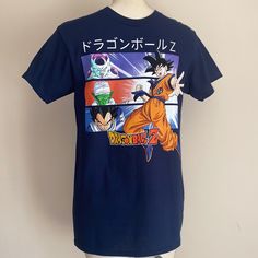 New Authentic Dragon Ball Z Men’s T Shirt Navy Blue New W Tags I Ship Same Or Next Day Blue Crew Neck Shirt With Front Print, Blue Graphic Tee With Front Print, Blue Short Sleeve Shirt With Screen Print, Blue Shirt With Screen Print For Fan Merchandise, Blue Short Sleeve Top With Front Print, Blue T-shirt With Front Print And Relaxed Fit, Blue Pre-shrunk Shirt For Fan Merchandise, Blue Short Sleeve Shirt For Fan Merchandise, The Police Band