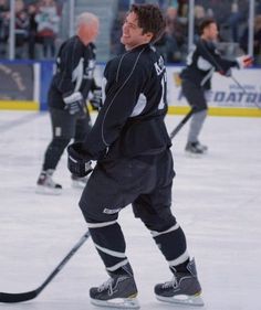 an ice hockey player standing on the ice