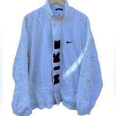 Vintage Nike White Wind Breaker Rare White Long Sleeve Track Jacket For Spring, Nike Vintage Long Sleeve Outerwear, Classic White Long Sleeve Track Jacket, White Long Sleeve Windbreaker For Fall, White Nike Windbreaker For Fall, Nike White Spring Outerwear, White Nike Outerwear For Spring, Classic Long Sleeve Track Jacket For Spring, Nike Long Sleeve Track Jacket For Spring