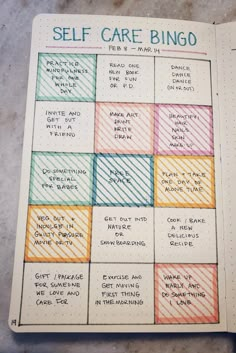 a notebook with some writing on it and the words self care bingo written in different colors