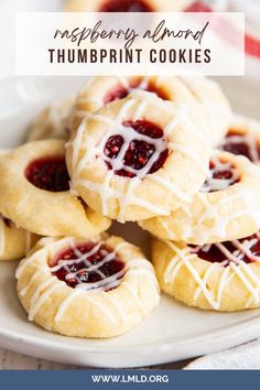 raspberry almond thumbprint cookies on a white plate with the title overlay