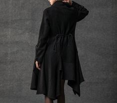 The asymmetrical swing coat will make any outfit go from drab to fab! This black wool coat has oodles of great designer details such as the stand-up collar and pixie rag hemline skirt. The wool coat is a fit-and-flare style that is very flattering on most women. When it's cold outside, there is nothing better than a comfortable but stylish new coat. You want to be unique but you also want to be warm and staying warm does not mean you have to look like the Michelin woman! This contemporary winter Casual Fitted Outerwear With Asymmetrical Hem, Black Asymmetrical Hem Outerwear For Fall, Fitted Black Asymmetrical Outerwear, Green Wool Coat, Princess Coat, Wool Winter Coat, Long Black Coat, Black Wool Coat, Military Coat