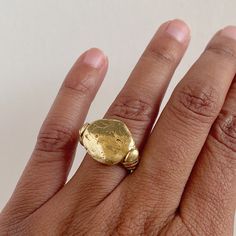 This shape is cast from a rock I found on the beaches of the Pacific Coast. The roundness and irregular shape envelop all the beauty that nature provides. Depending on casting, each rock will look completely unique with its own markings and character. Along the side of the ring, are hand-formed serpents. COMPOSITION 18K Recycled Gold 4 or 6 Ring Size Alternate sizes available upon request Hammered Open Ring In Recycled Gold, Hand Cast Minimalist Round Jewelry, Minimalist Hand Cast Round Jewelry, Hand Cast Oval Gold Jewelry, Hand Cast Gold Jewelry In Oval Shape, Unique Hammered Rings In Recycled Gold, Unique Hand Forged Signet Ring, Hand Cast Yellow Gold Open Ring Jewelry, Unique Hand Cast 14k Gold Rings