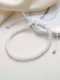 Simple Beaded Bracelet Adjustable White Stretch Bracelet For Party, White Crystal Bracelet With Faceted Beads For Party, Elegant White Friendship Bracelets With Colorful Beads, White Round Beads Crystal Bracelet For Party, White Stretch Bracelet With Faceted Beads For Party, White Crystal Bracelet With Round Beads For Party, White Beaded Crystal Bracelet For Party, Adjustable Beaded Stretch Bracelet In Pearl White, Adjustable Pearl White Beaded Stretch Bracelet