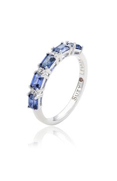 A polished sterling silver ring features baguette-cut pink or blue sapphires and round lab-created white sapphires for elegant sparkle. 1/4" band width Sterling silver/blue or pink sapphire/lab-created white sapphire Imported Silver Sapphire Ring With Baguette Diamonds, Silver Sapphire Ring With Baguette Diamonds, Emerald Cut, Fine Jewelry White Gold Sapphire Ring With Baguette Diamonds, White Gold Sapphire Ring With Baguette Diamonds, Anniversary Sapphire Ring With Baguette Diamonds In White Gold, Anniversary White Gold Sapphire Ring With Baguette Diamonds, Sapphire Rings With Baguette Diamonds, Silver Sapphire Ring, Blue Or Pink