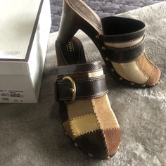 Unique Style, Original Coach Design, New With Tag, Never Used, Size 8 But Fits Smaller. Coach Leather Mules With Round Toe, Casual Coach Slip-on Mules, Coach Casual Closed Toe Heels, Casual Coach Closed Toe Heels, Casual Closed Toe Coach Heels, Casual Coach Leather Heels, Casual Leather Coach Heels, Coach Leather Slip-on Heels, Casual Brown Coach Heels