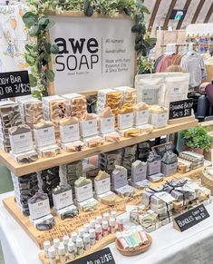 an assortment of soaps on display at a market