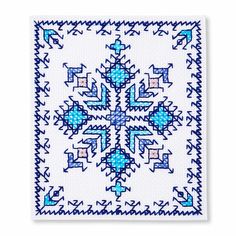 a blue and white cross stitched design