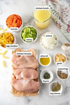 ingredients to make chicken broth laid out on a marble counter top with text overlay