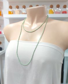 "This is a one strand beaded sage green necklace, with NO CLASP, and can be worn in multiple ways, as shown in pictures. ❤ SIZES This item is one size fits all. ❤ PROCESSING AND SHIPPING Most orders are made and shipped out in one business day. Please check delivery timeframes for your location on the description below. ❤ CUSTOM ORDERS If you like this item in a different color, send me a message indicating: color, size and quantity needed. I will send you a link for a \"custom order\" and you'l Dainty Green Beaded Necklaces With Round Beads, Dainty Green Beaded Necklace With Round Beads, Dainty Green Beaded Necklaces, Dainty Handmade Green Beaded Necklace, Dainty Green Single Strand Necklace, Green Bohemian Crystal Necklace With Tiny Beads, Green Dainty Necklace With Tiny Beads, Dainty Green Beaded Necklace, Green Multi-strand Jewelry With Tiny Beads