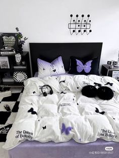 a bed with black and white decorations on it