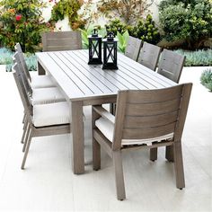 an outdoor table and chairs on a patio