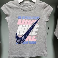 Nwt Bin A.Rn Nike Pink Tops With Letter Print, Nike Pink Top With Logo Print, Nike Sporty Pink T-shirt, Pink Nike Tops With Letter Print, Pink T-shirt With Logo Print For Spring, Sporty Pink Cotton Shirt, Pink Cotton Sporty Shirt, Sporty Short Sleeve Pink Shirt, Sporty Pink Nike T-shirt