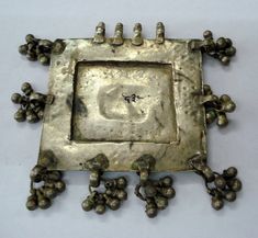 an old metal frame with grapes on it